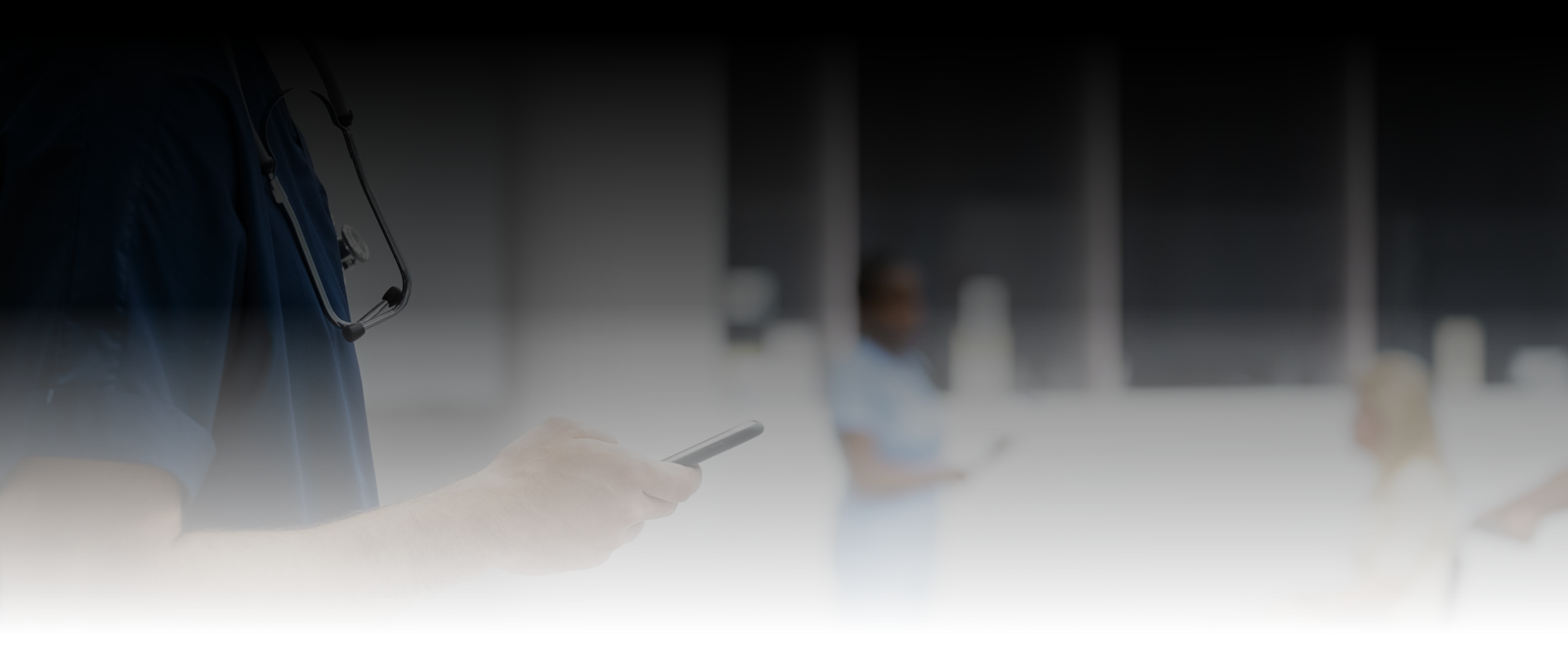 Medical professional using smartphone in a clinical setting